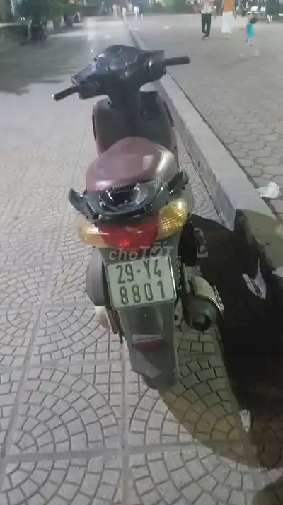 Черный скутер Honda PS
